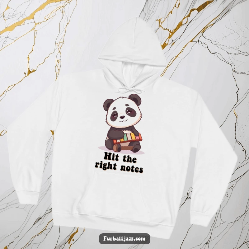 Funny panda hoodie with a cute bear playing a xylophone with a thoughtful smile, embodying peaceful musical enjoyment.